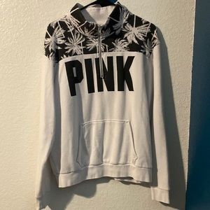 Sweater from pink zips half way with a middle pocket and covers the neck area